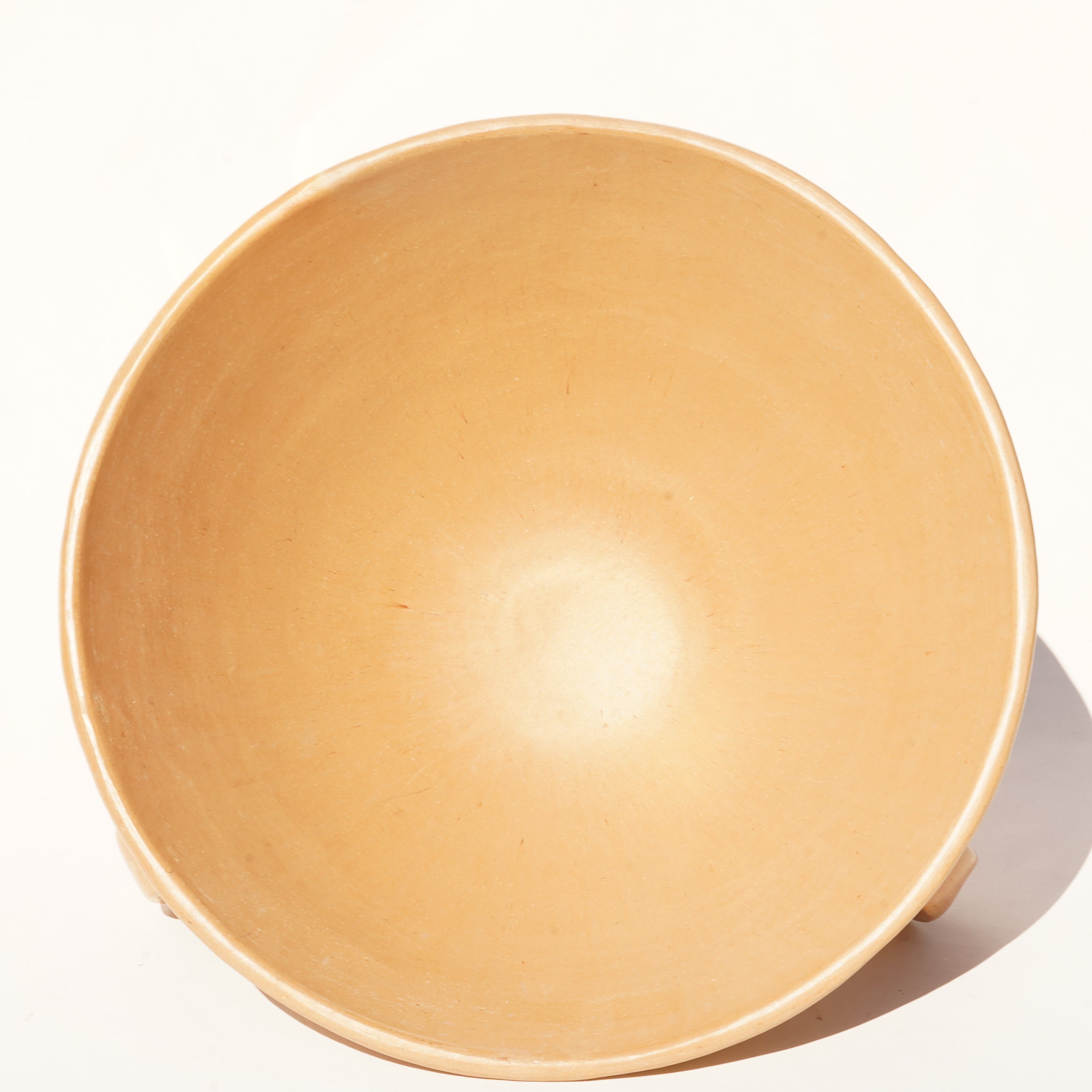 Rounded footed beige bowl