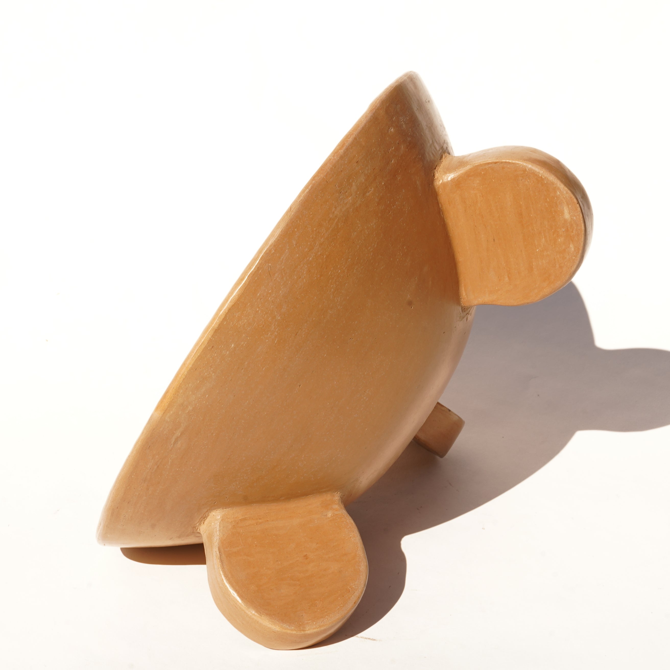 Rounded footed beige bowl